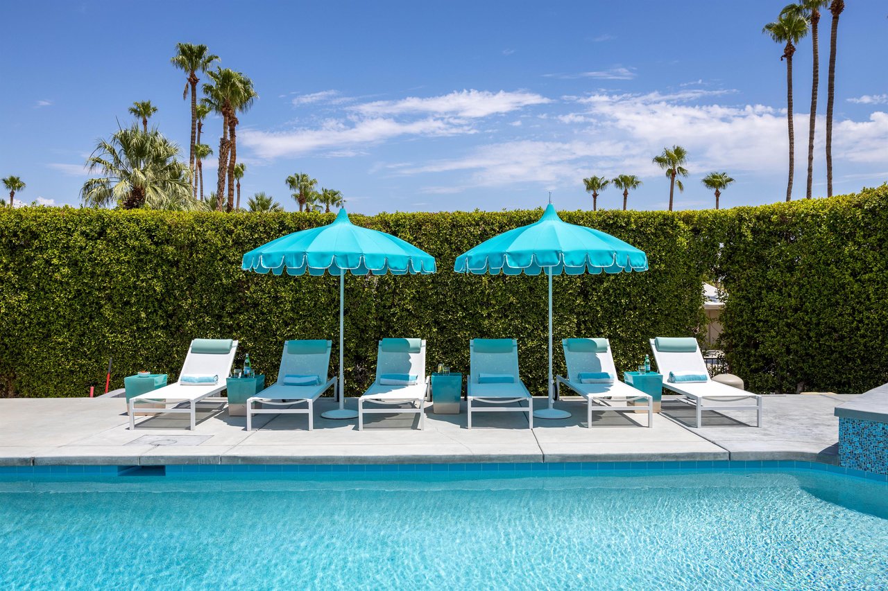 Six Lined Up Pool Lounge Chairs