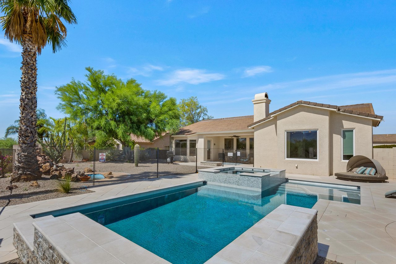 Fenced in pool area in backyard
