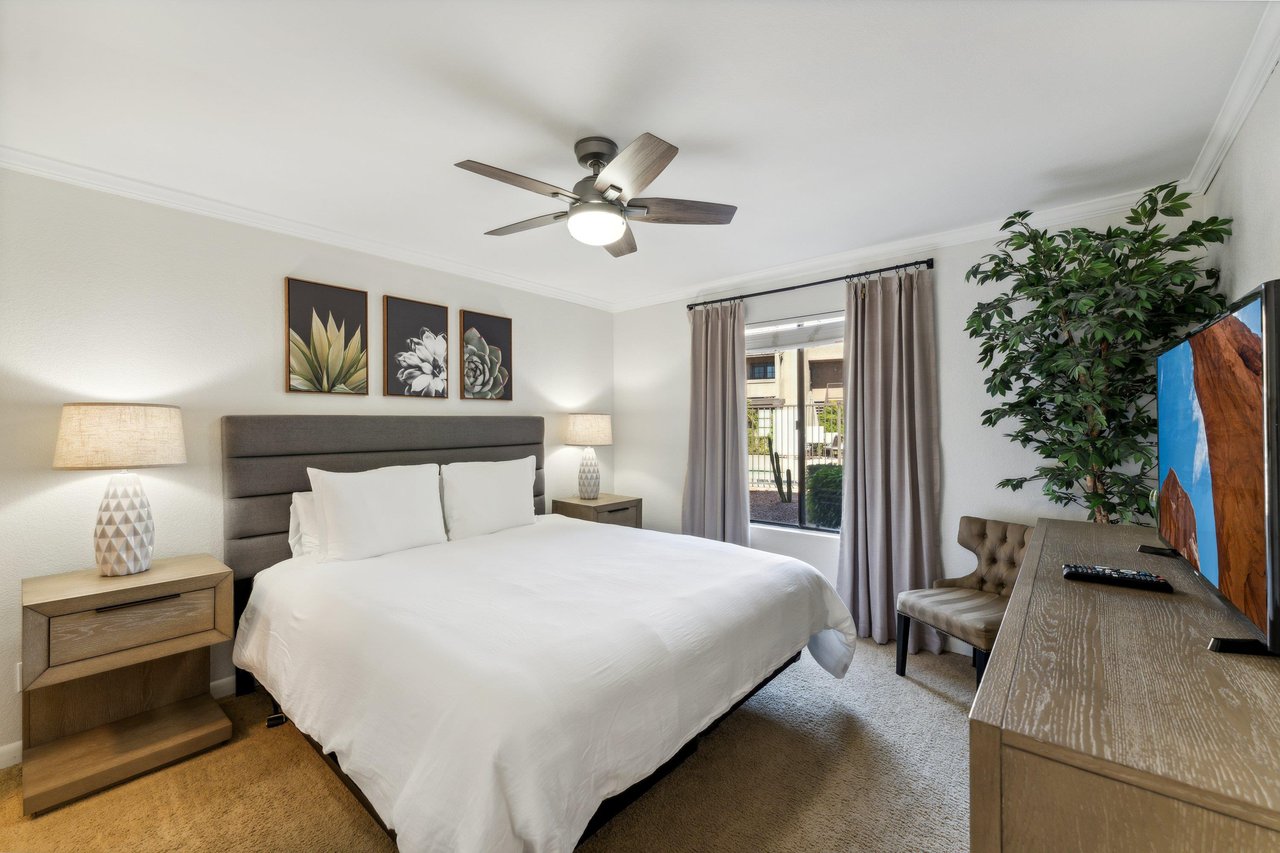 Private Bedroom features a California King bed, bright furnishings and a Smart TV