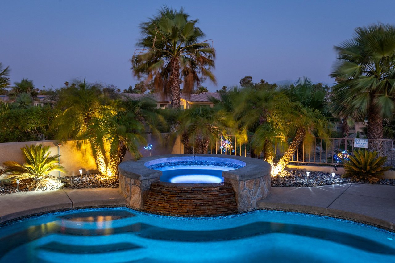 Take a soak in the beautiful waterfall spa at night