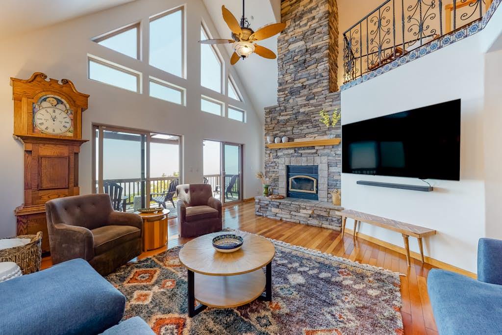 Featuring AMAZING views, plenty of seating, vaulted ceilings, Wood Burning stove, and a Smart TV