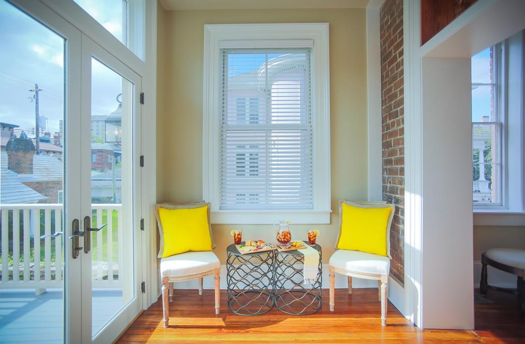 Double doors lead out to an upper level patio.