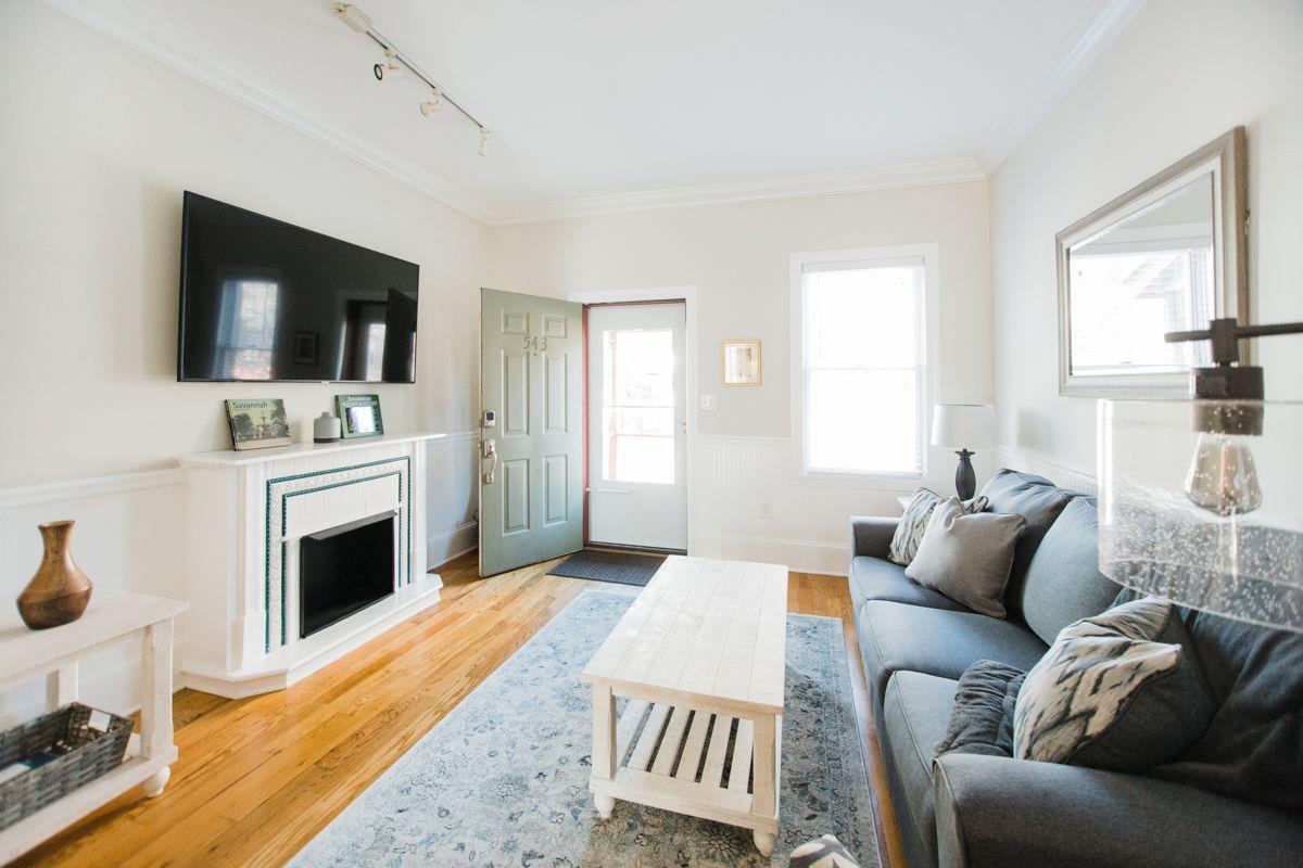 The now decorative fireplace has been preserved and updated with hand laid tile.