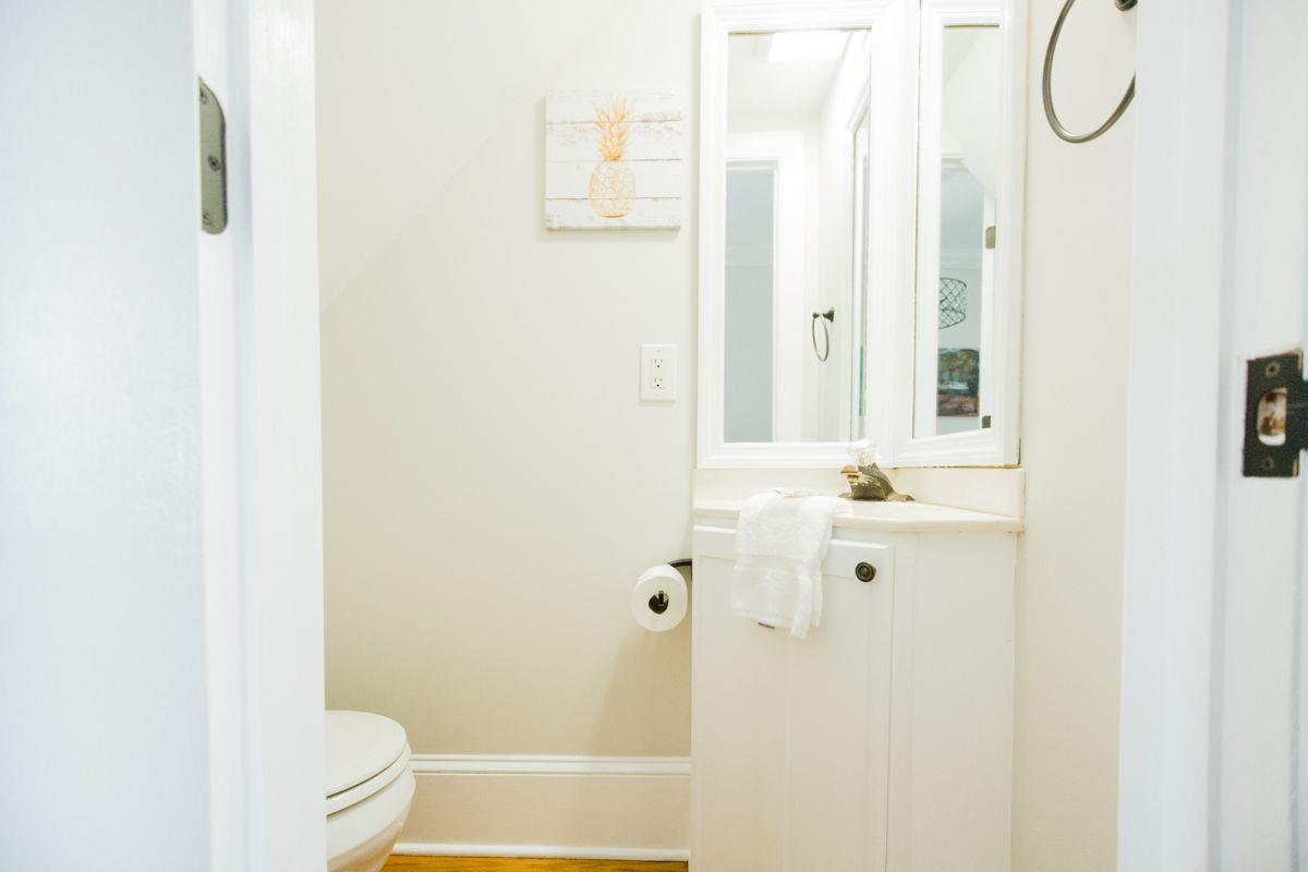 Conveniently tucked beneath the stairs.