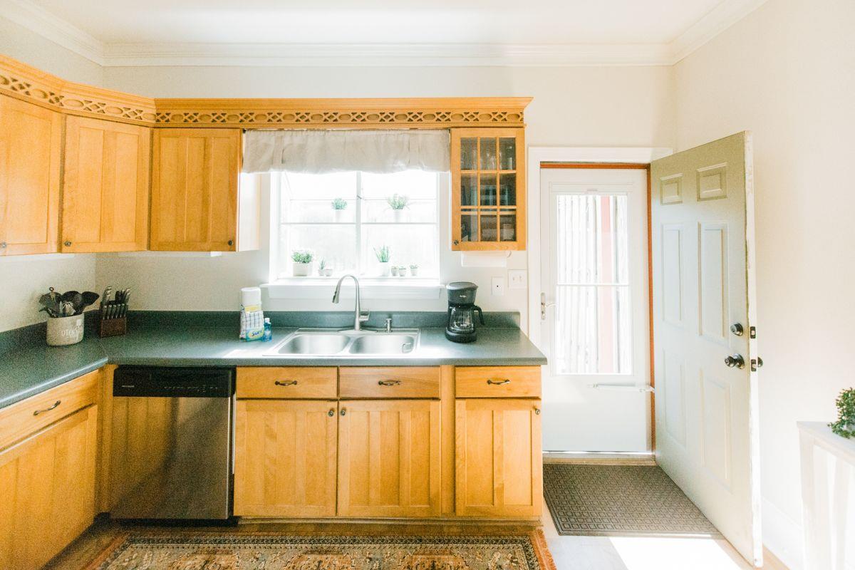 The back door opens up to your private courtyard, fitted with a patio set.