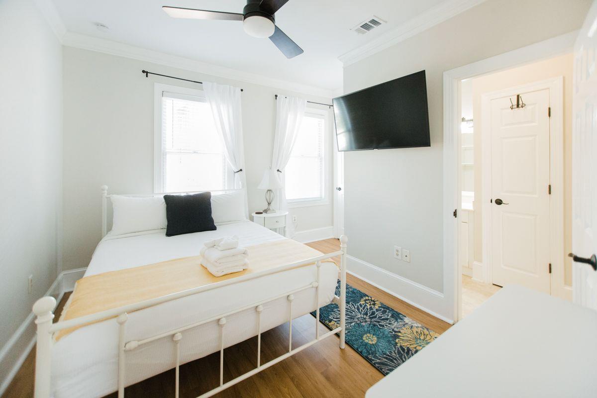 The first bedroom sits atop of the stairs.