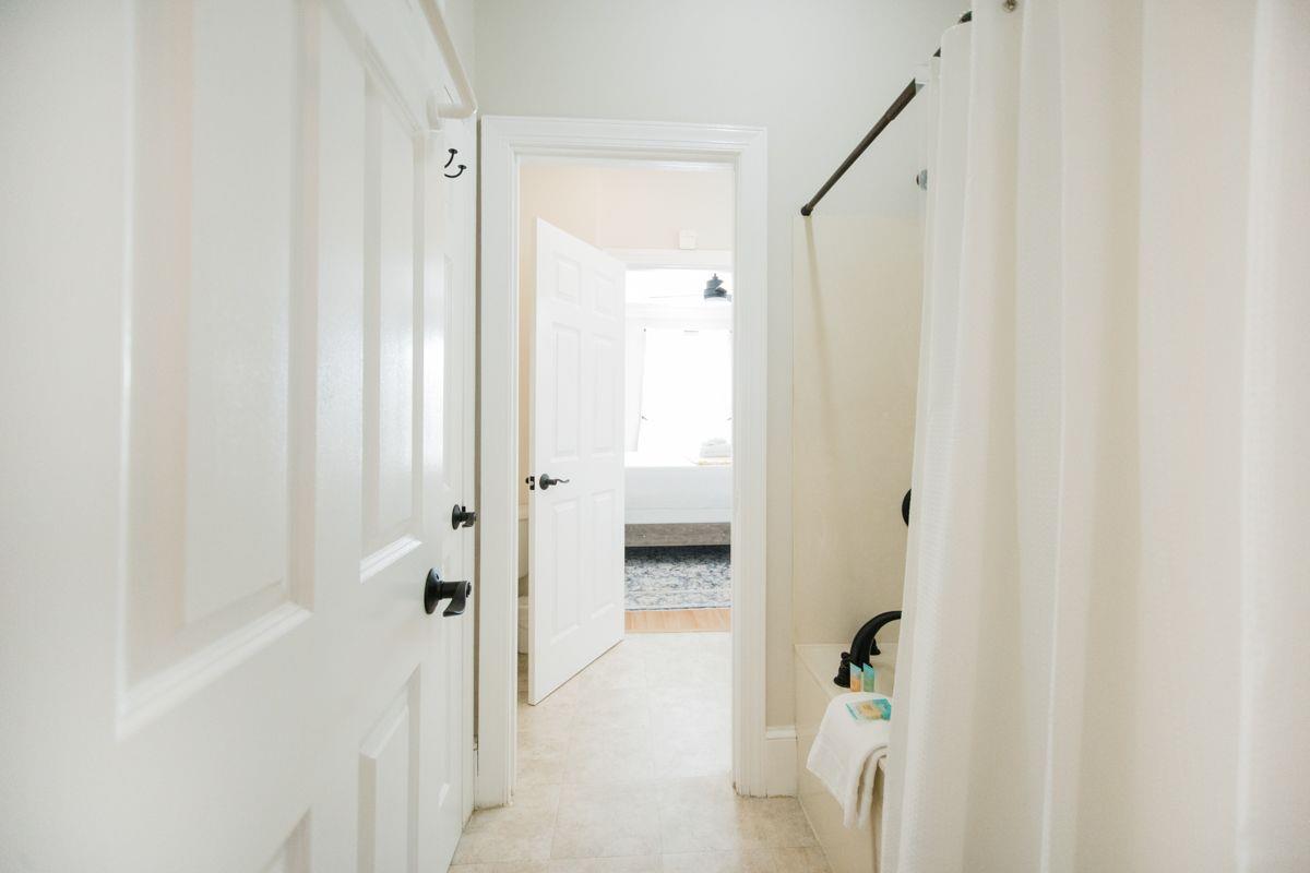 Shared between the two rooms, you will find the large soaking tub and shower combination.