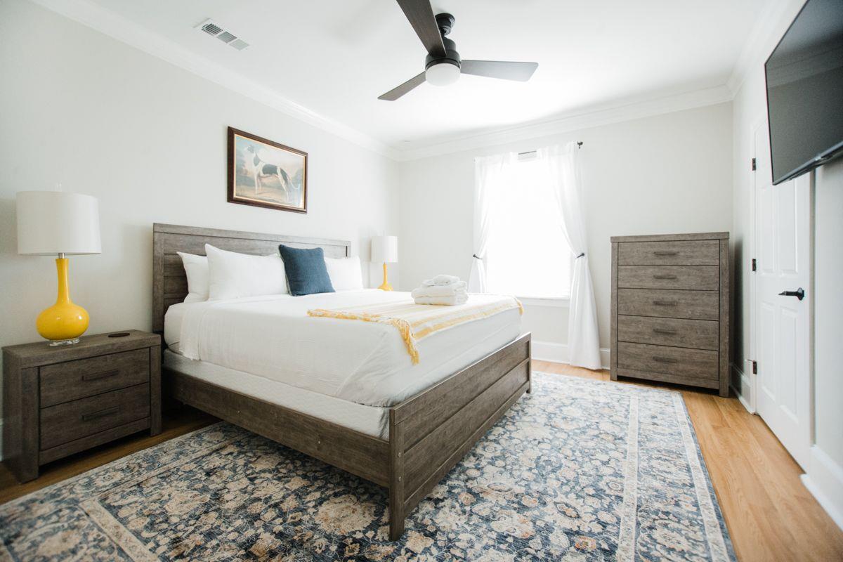 The master offers an ample amount of storage, and  a king size bed.