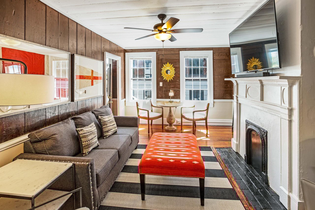 A large smarttelevision is mounted above the original now decorative fire place. Guests will be able to stream their favorite shows from their accounts.