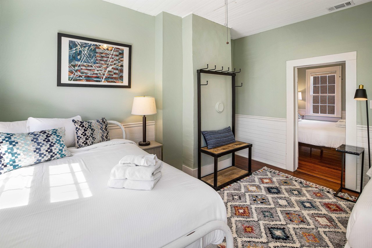 Heading across the hall, youll find the third bedroom, that connectscloses off to the fourth.