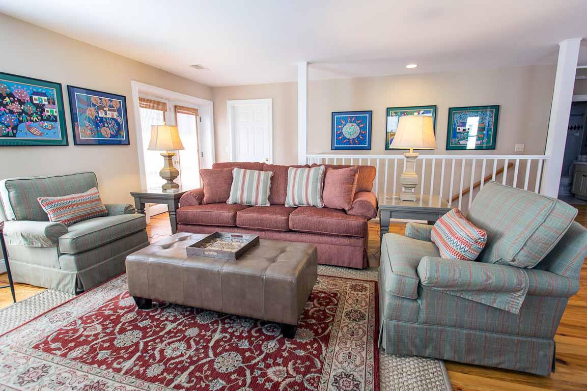 A full flight of stairs leads to this upper level apartment.