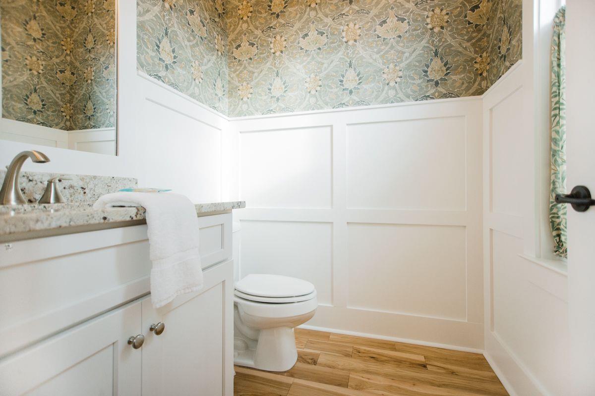 Ideal for guests using the sleeper ottoman, the main level offers a bathroom.