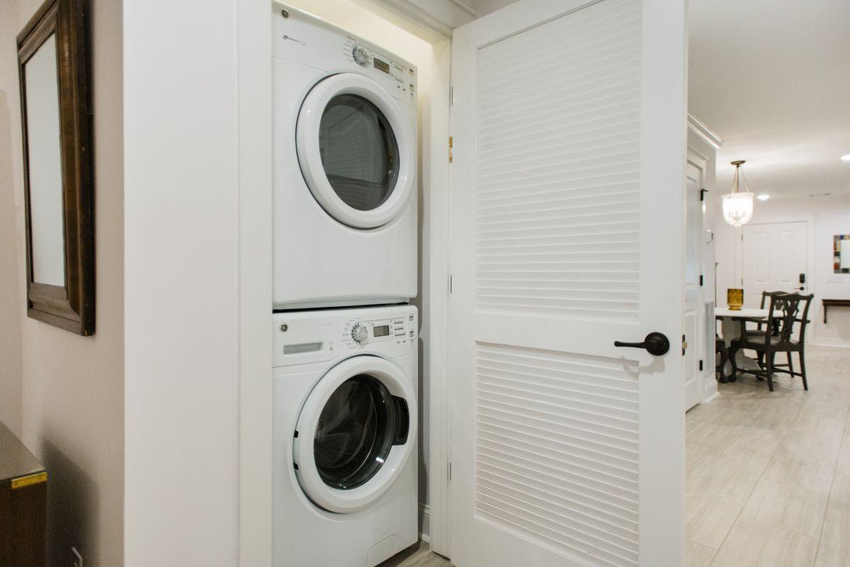 A fullsize stackable washer and dryer has been added to the ground level.