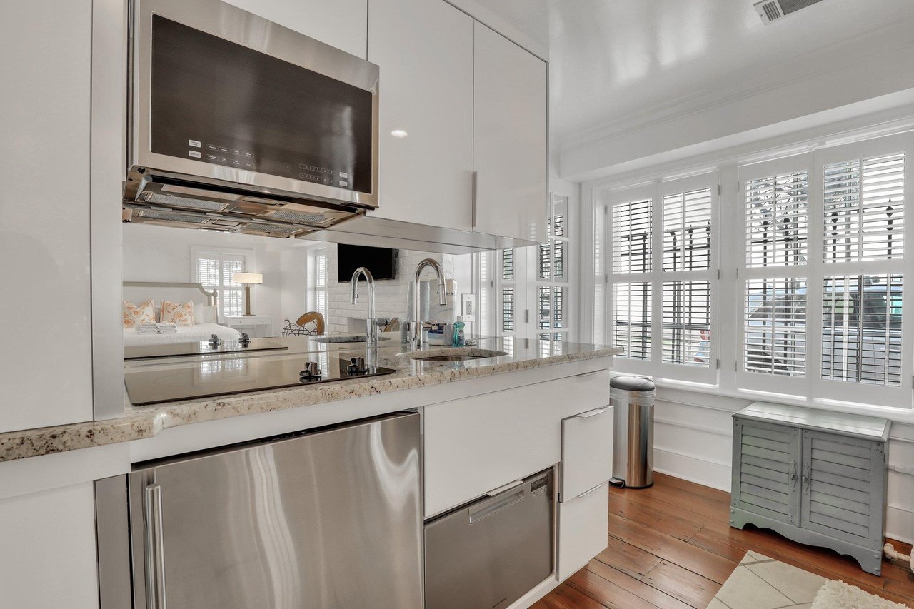 The kitchenette offers a fridge drawer and industrial convection microwave.