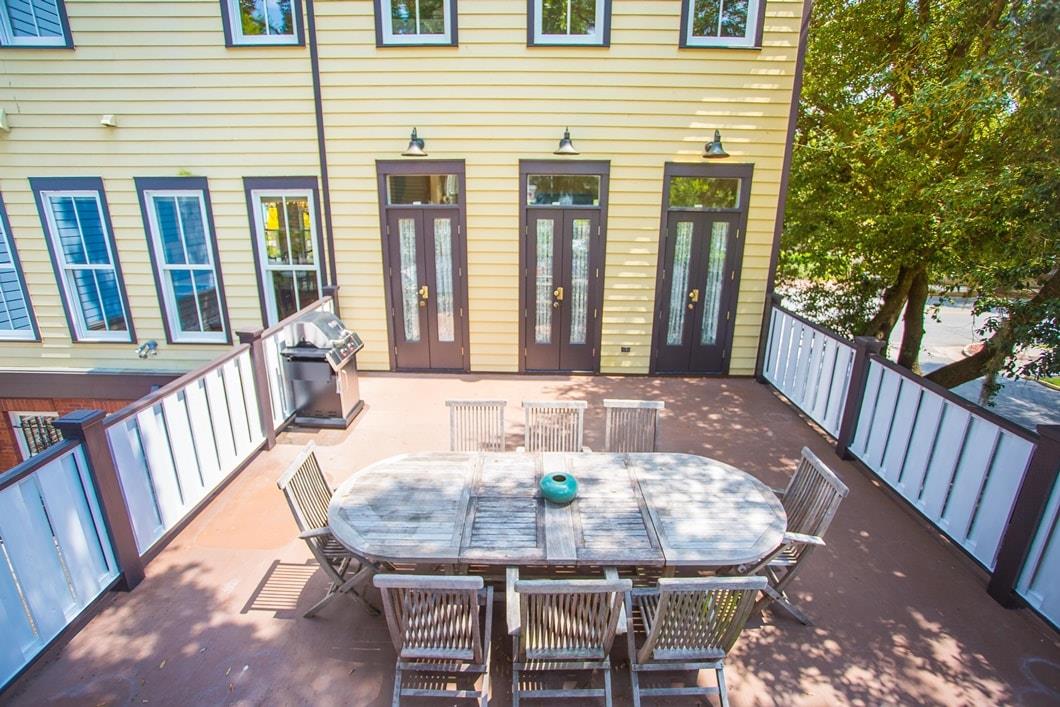Outdoor dining on the deck with a grill.