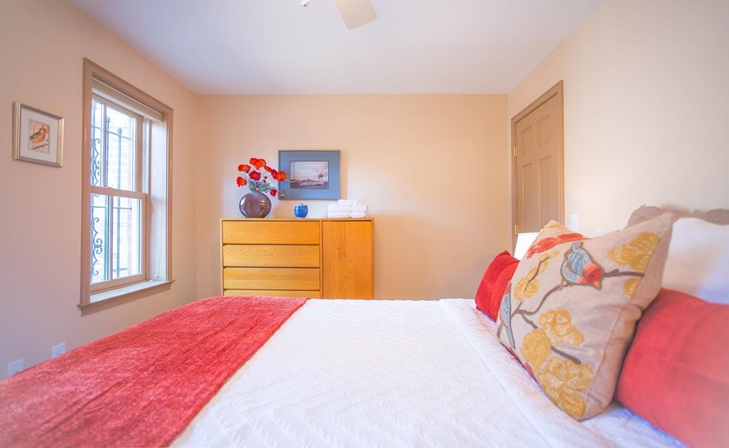 Second Garden Level bedroom has a queen bed and plenty of storage