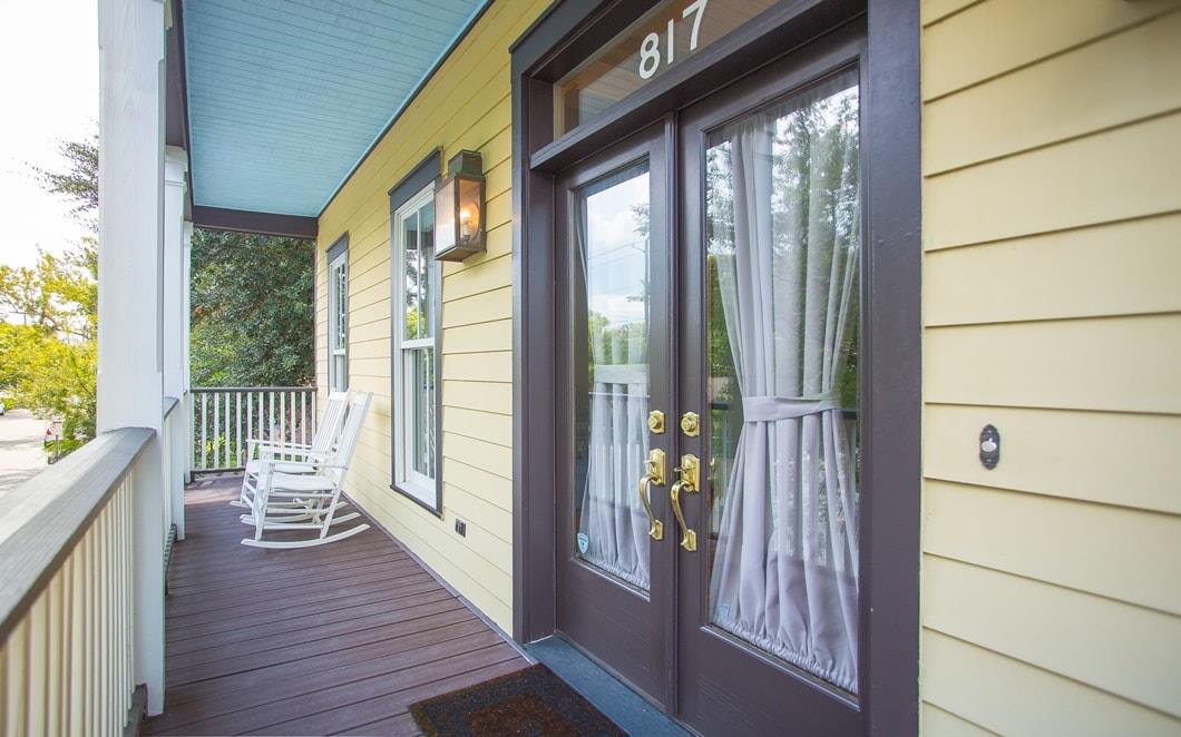 Large french doors let a great amount of light into the primary bedroom.