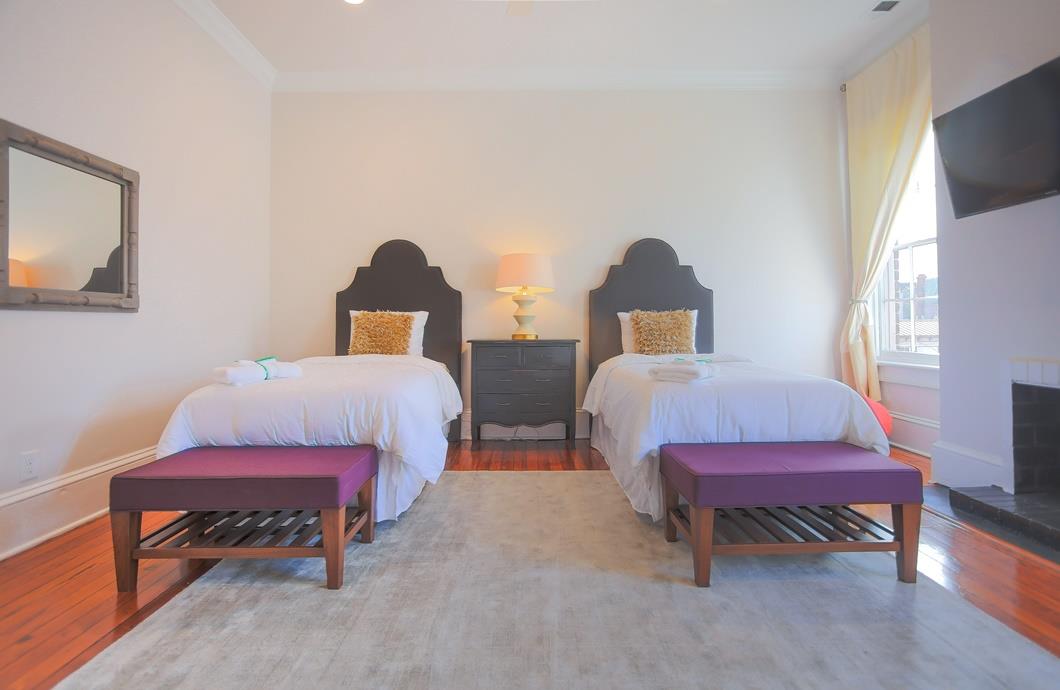 Bright pops of color bring this twin bedroom to life.