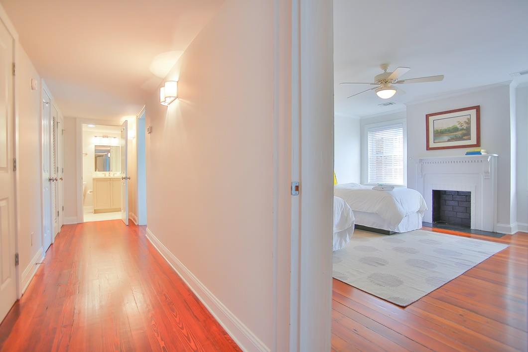 Down the hall to your right is the second twin bedroom and ahead of you is the downstairs full bathroom.