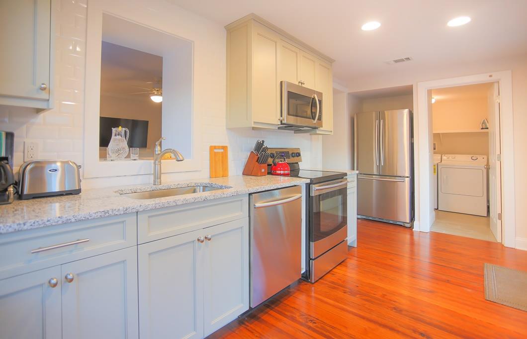 Washer and dryer are located off of the kitchen area.
