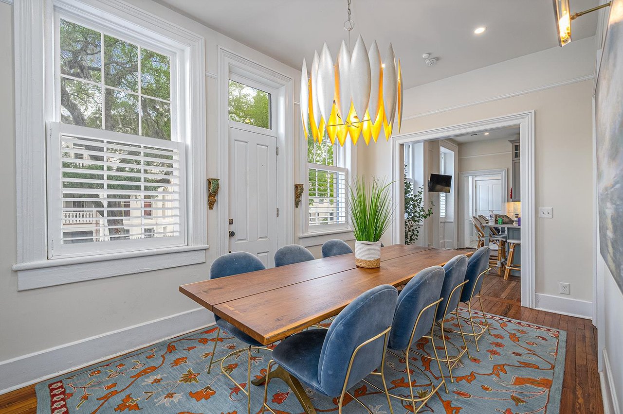 The eye catching chandelier and beautiful artwork tie this space together.