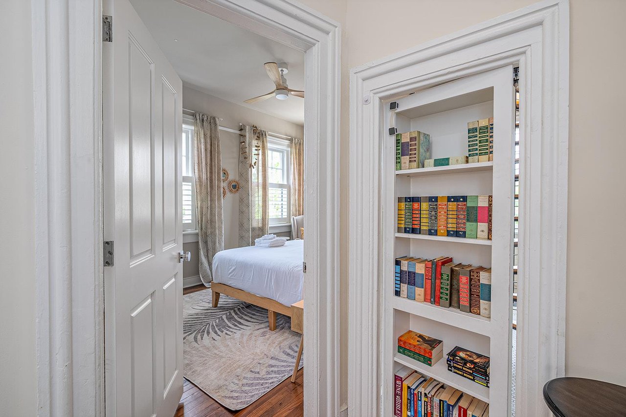Hidden behind the bookshelf guests will find a private oasis just beyond the spiral staircase.