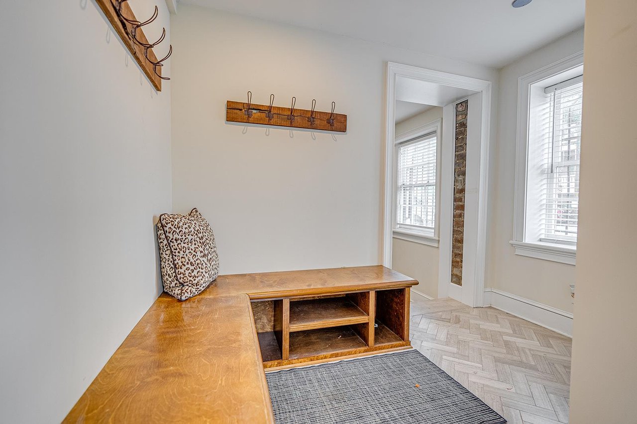 The mud room located off of the courtyard is a great place to tuck shoes and stow jacketsumbrellas.