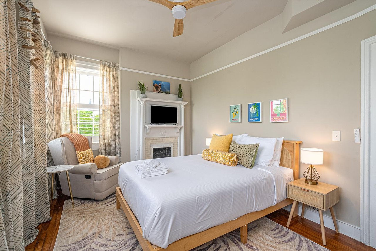 At the back of the house, a charming bedroom with a queen bed is offered.