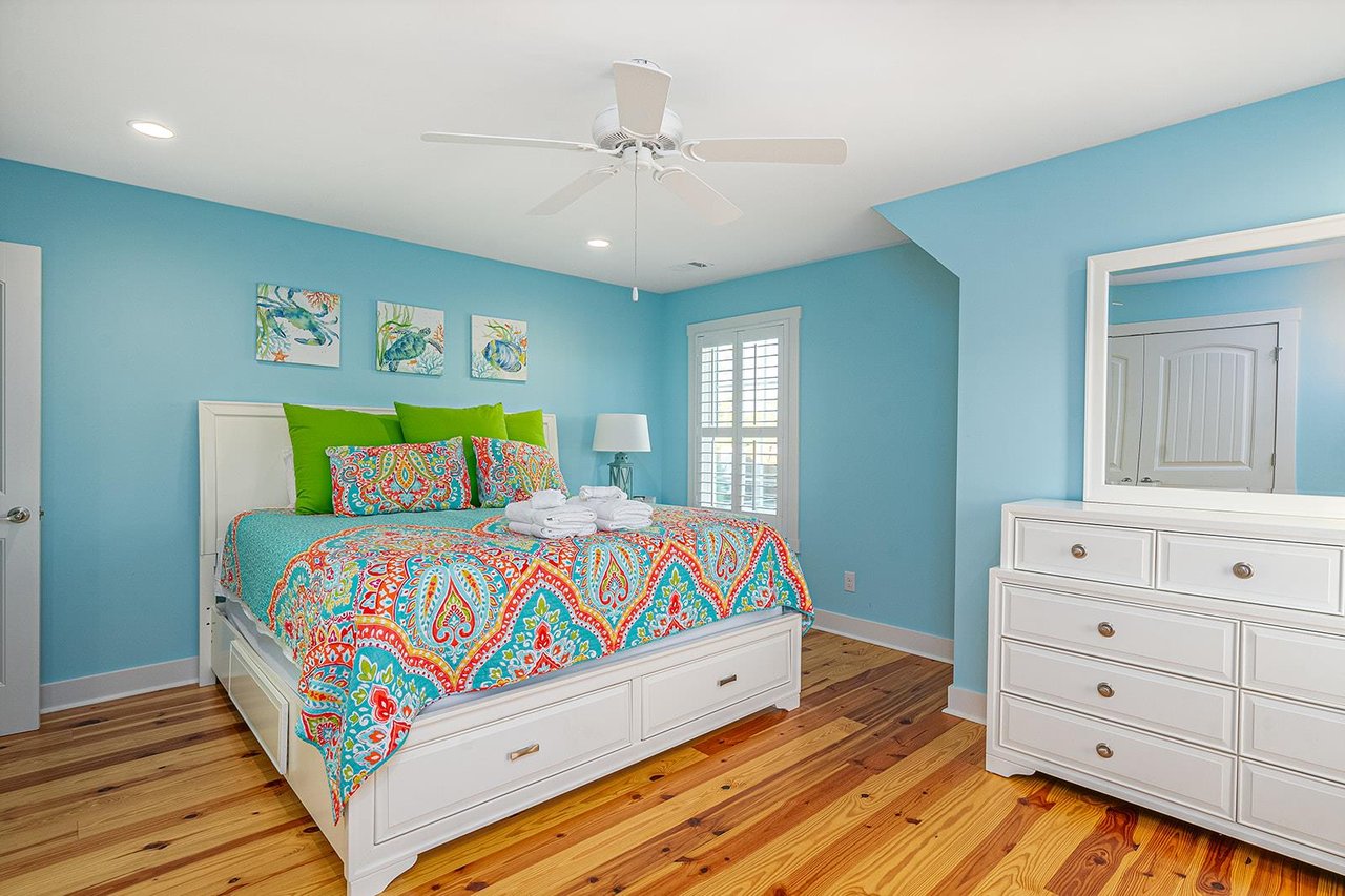 The second guest room features a King bed with an ample amount of storage.