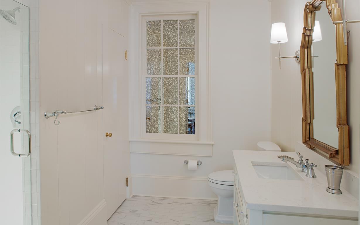 The ensuite offers a large vanity, and spacious tiled walkin shower.