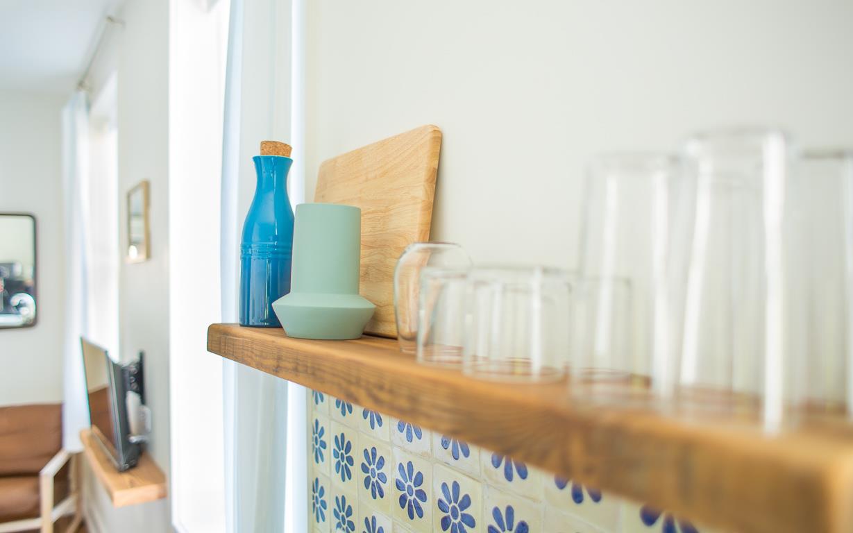 Dishes, utensils, and dish soap are provided.