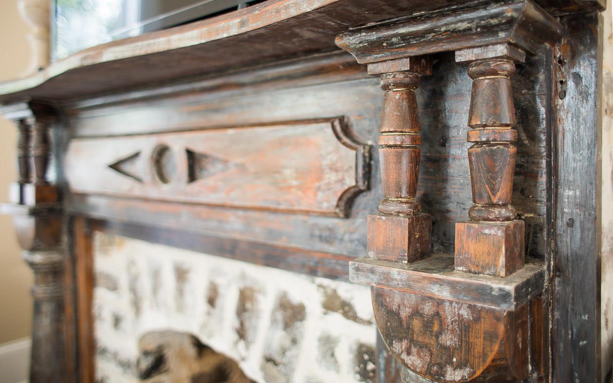 The antique fireplace mantel is a true treasure.