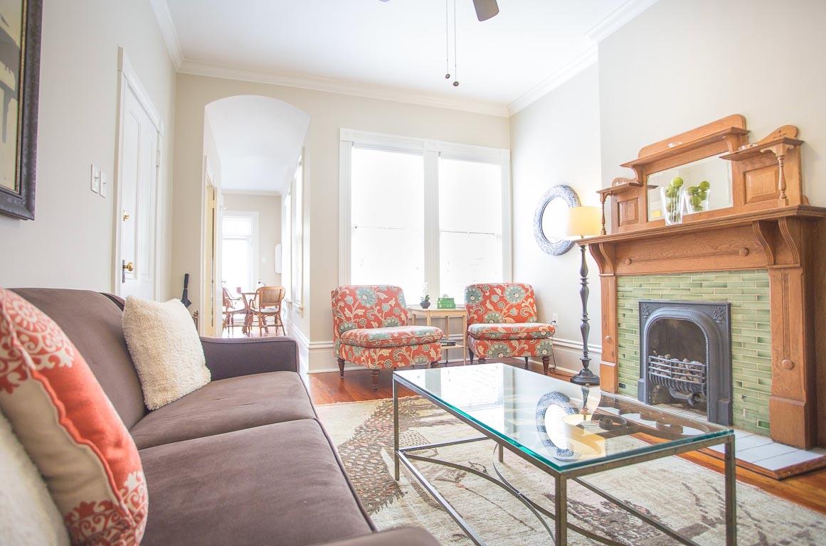 The original fireplace  now decorative  anchors the living room.
