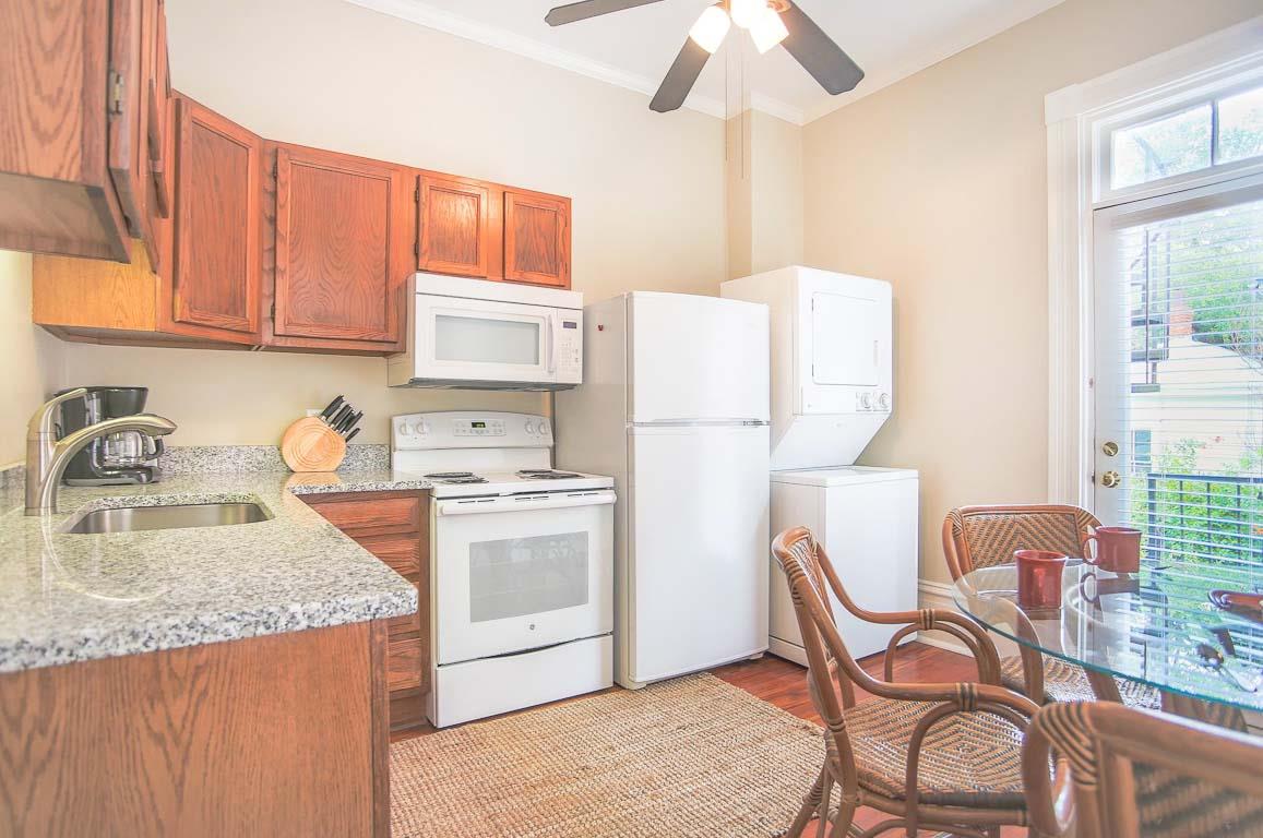 The full kitchen is stocked with all of the essentials.