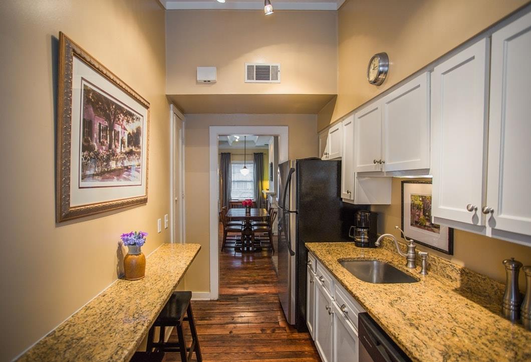 This galley kitchen has a breakfast bar