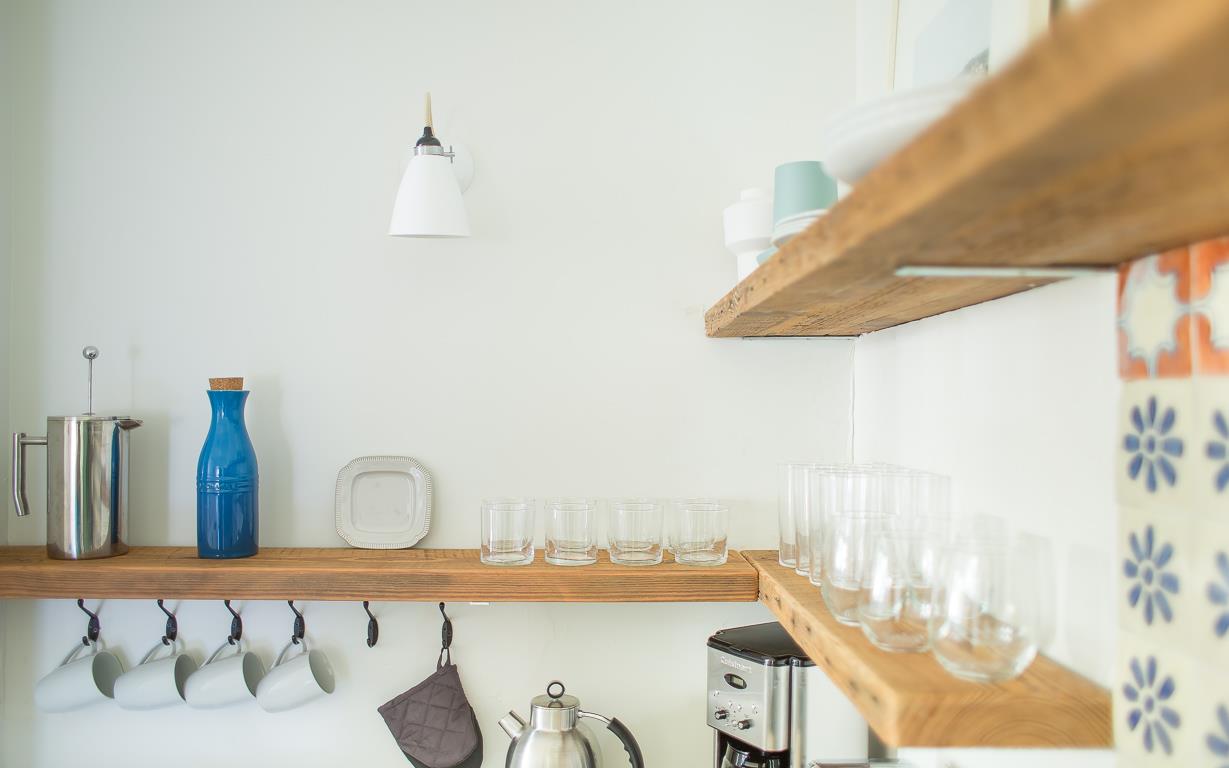 Store dishes on the open shelves after use.