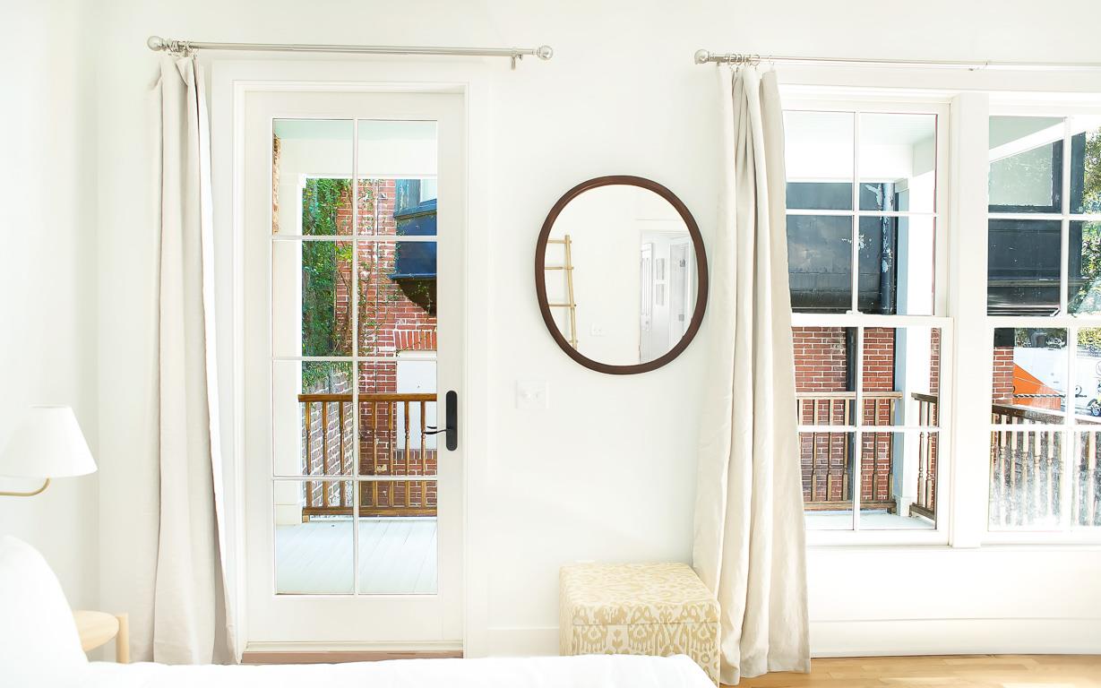 This bedroom includes a private balcony.