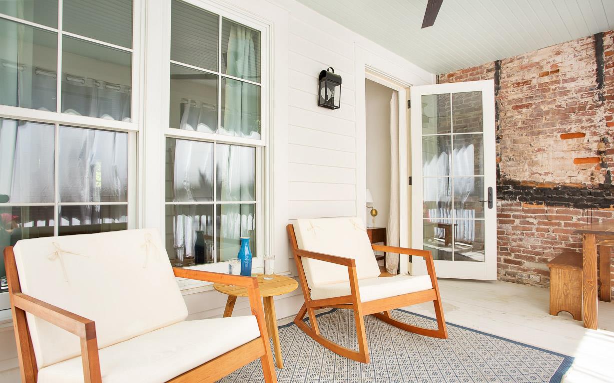 Relax on the patio right off of the primary bedroom. Take in the Bull Street view
