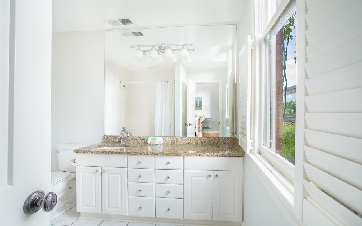 This second full bath has a tubshower combination.