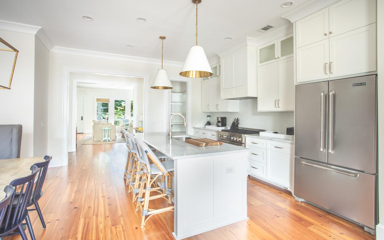 Stainless steel appliances and marble countertops.
