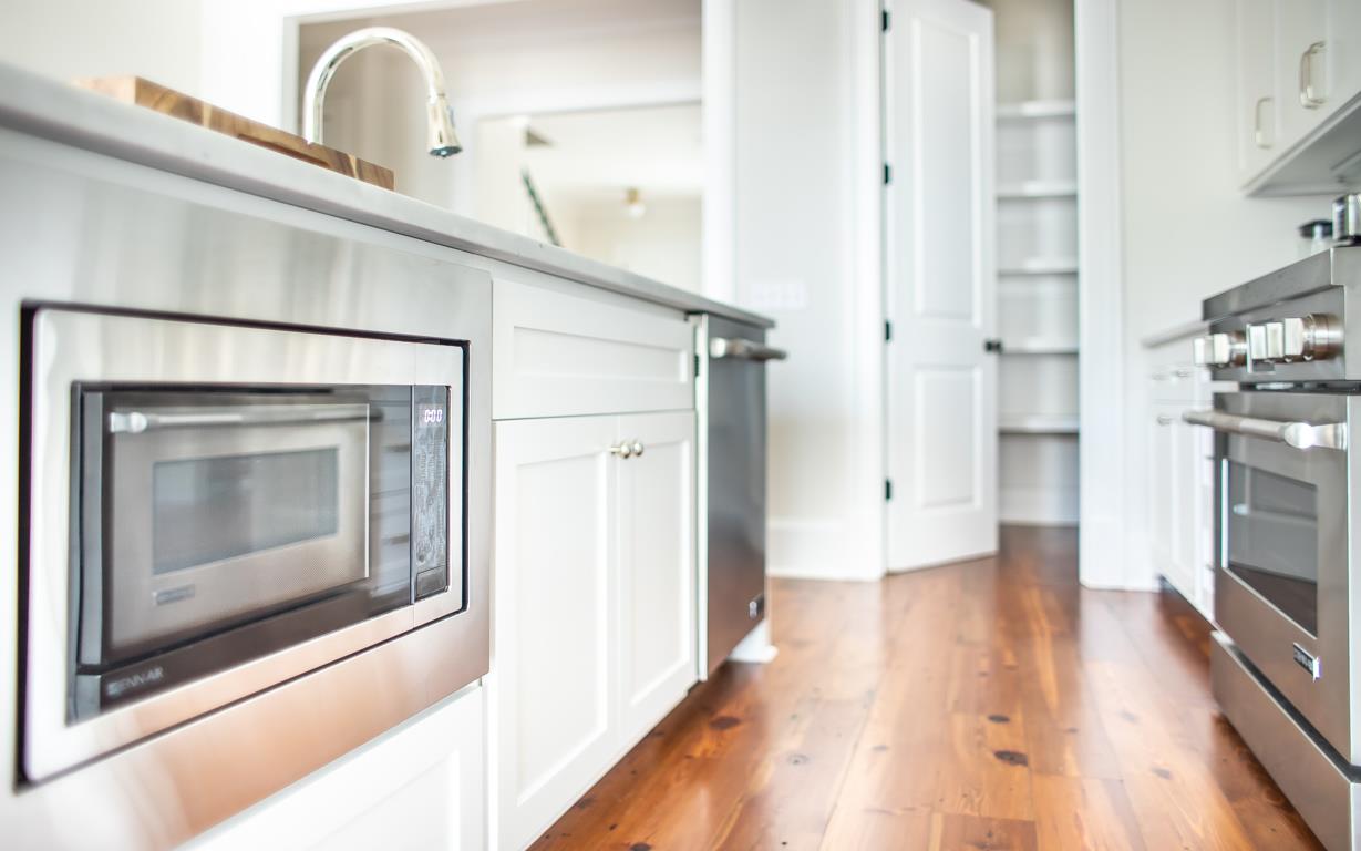 The kitchen comes fully equipped with microwave, dishwasher, and range.