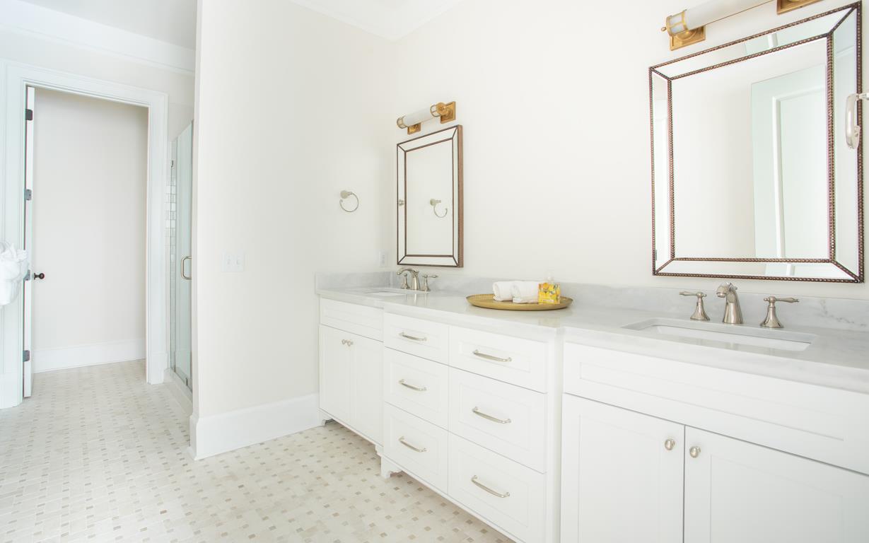 The primary bath features a double vanity.