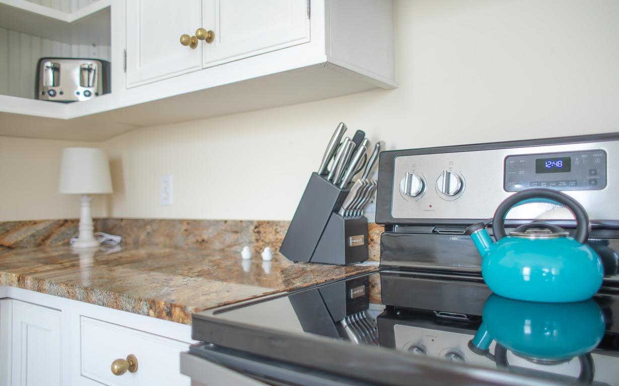 Both a tea kettle and coffee maker are provided.