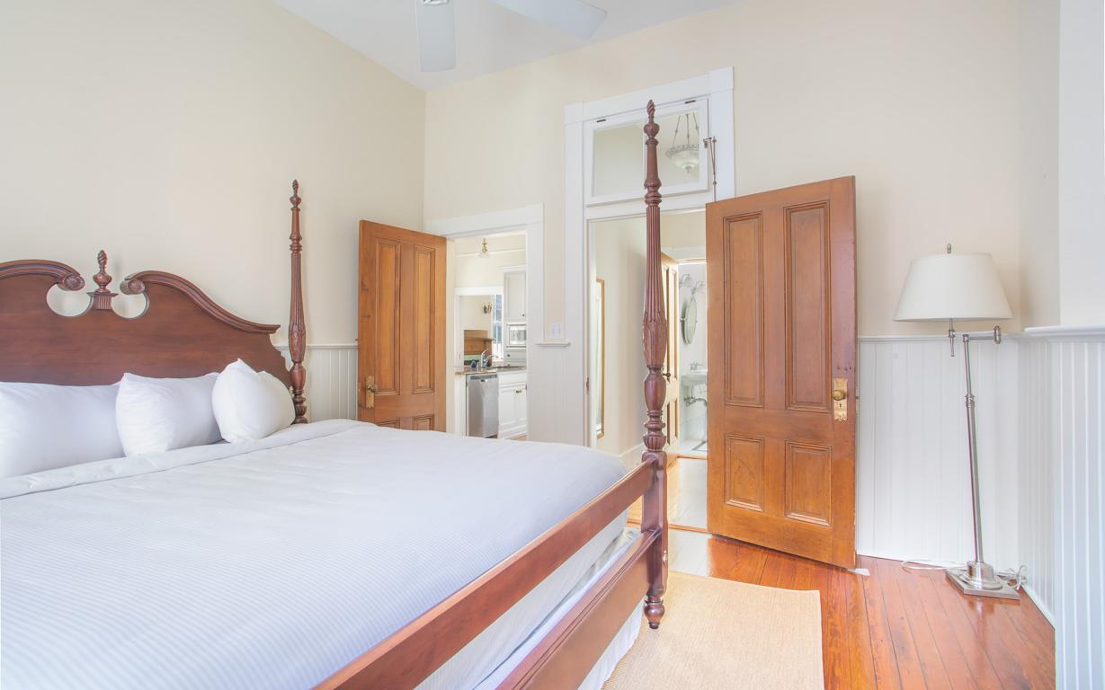 The first bedroom is off of the kitchen.