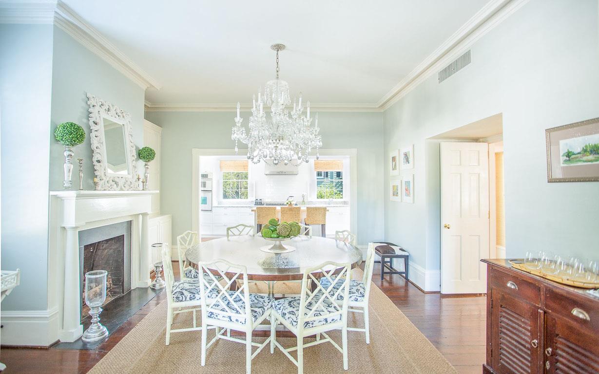 The dining room, with its large, round table is also bright and spacious.