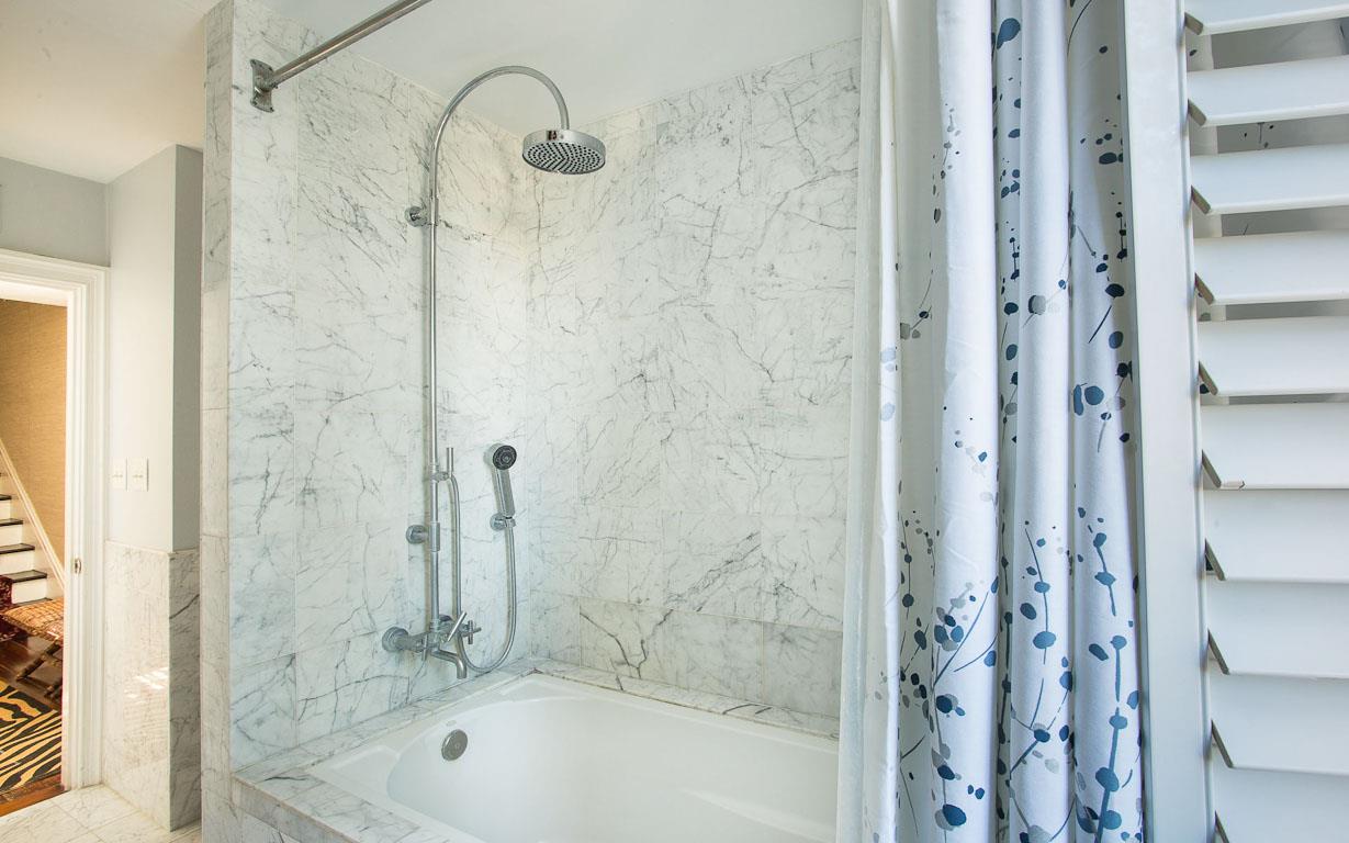 View of the tubshower combo in the primary bath.
