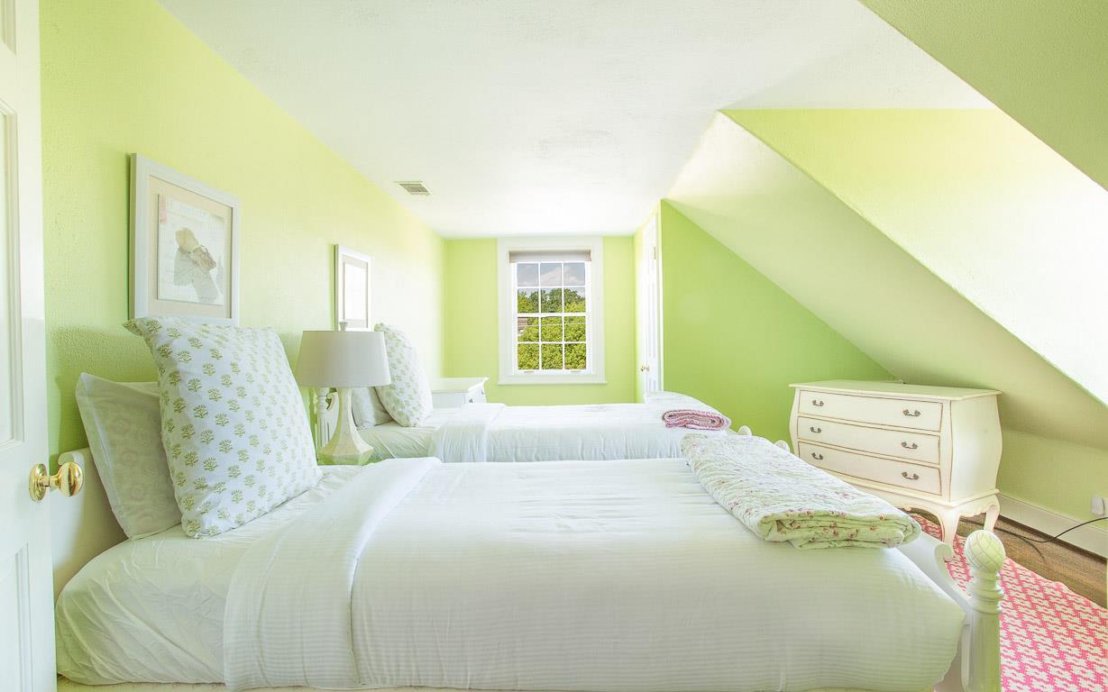 Our pink and green guest room on the third floor is festive and fun