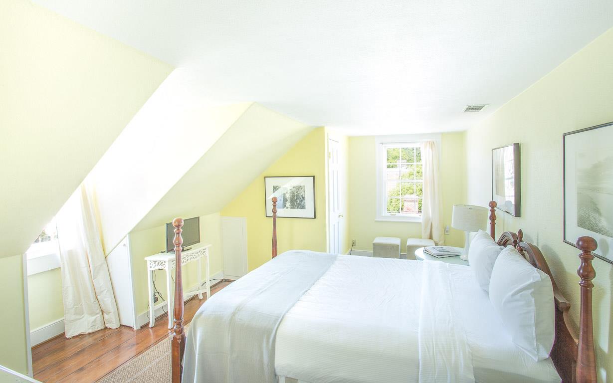 Another guest room is very bright and has nice views of the city at night