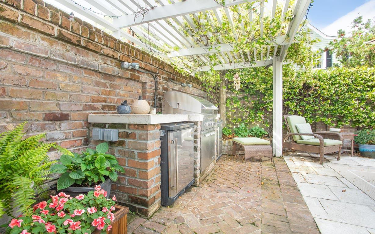 The private back courtyard with builtin grill and refrigerators.