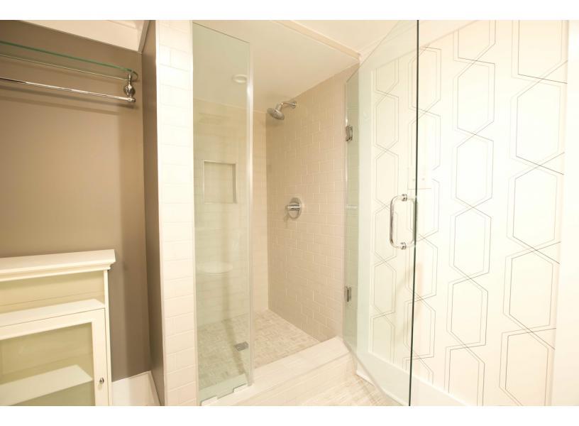 Walkin shower with rain water shower head.